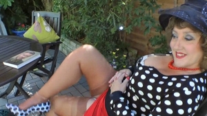 Dirty granny masturbates with big dildo